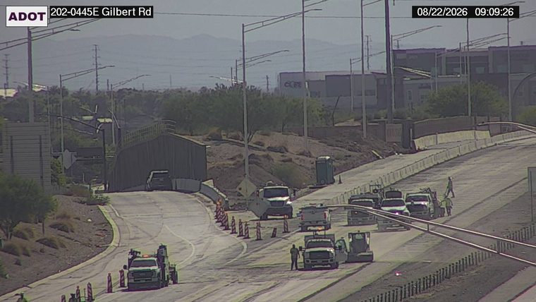 Construction cones and workers in the roadway