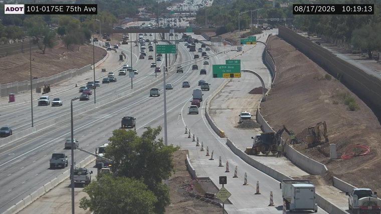 Construction equipment and workers in the right lanes