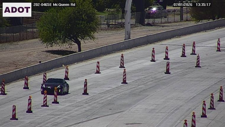Construction cones and a vehicle in the roadway