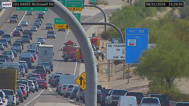 Fire truck and ambulance with emergency lights on the right shoulder