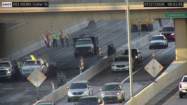 Workers and equipment in the left lane