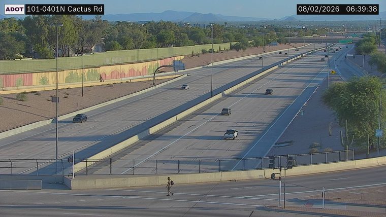 Person crossing the roadway in the foreground
