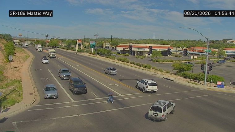 Person crossing the roadway in the crosswalk