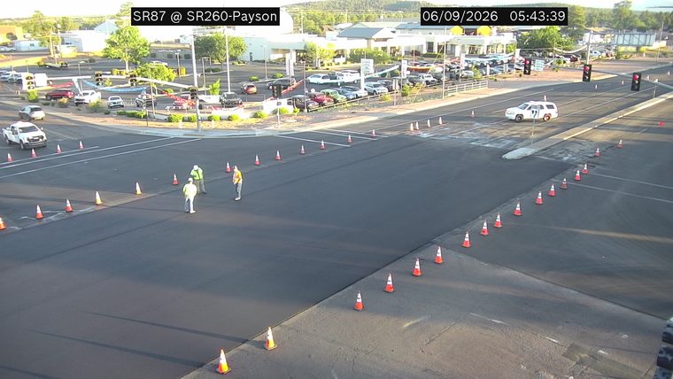 Construction cones and workers in the roadway