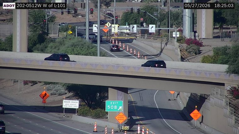 Construction cones and barrels blocking lanes on both the upper and lower roadways