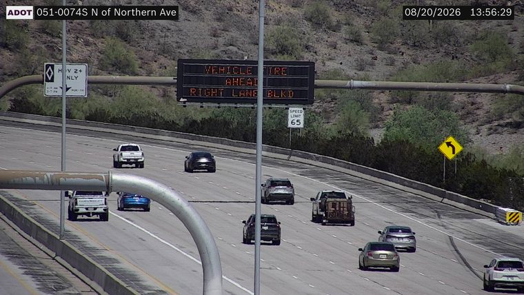 VEHICLE FIRE AHEAD RIGHT LANE BLKD sign displayed
