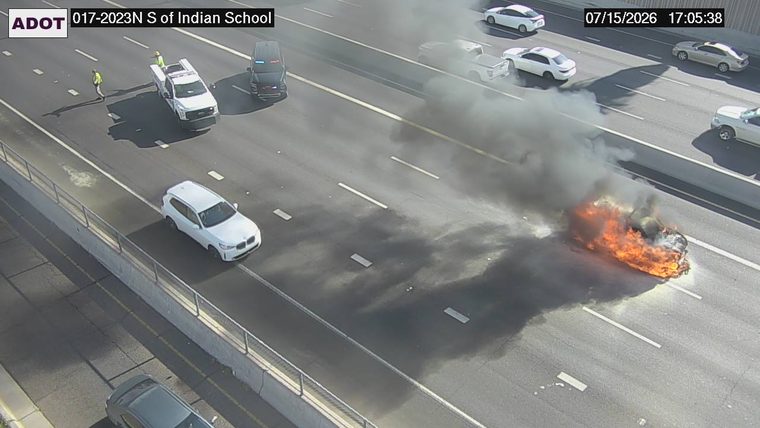 Vehicle on fire in the right lane