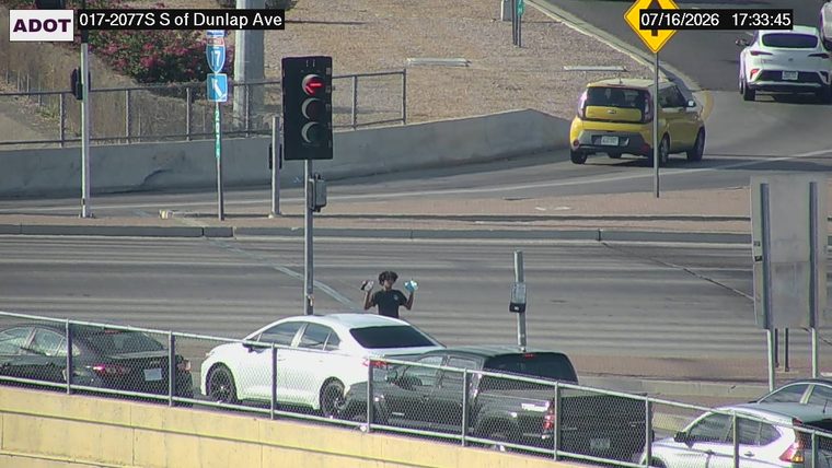 Person standing in the roadway