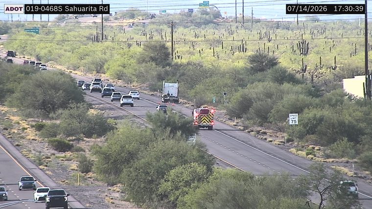 Fire truck with red and blue lights on the right lane