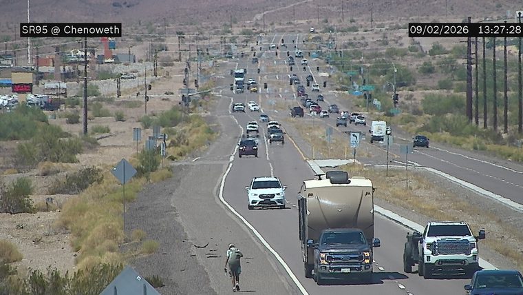 Person on a scooter in the left lane