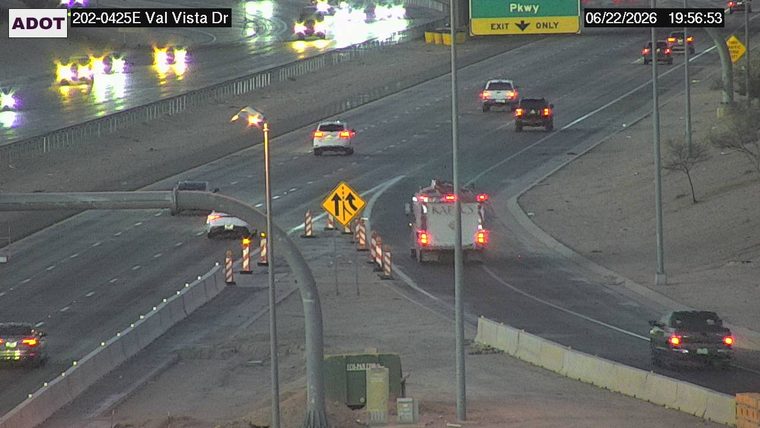 White vehicle on the left shoulder