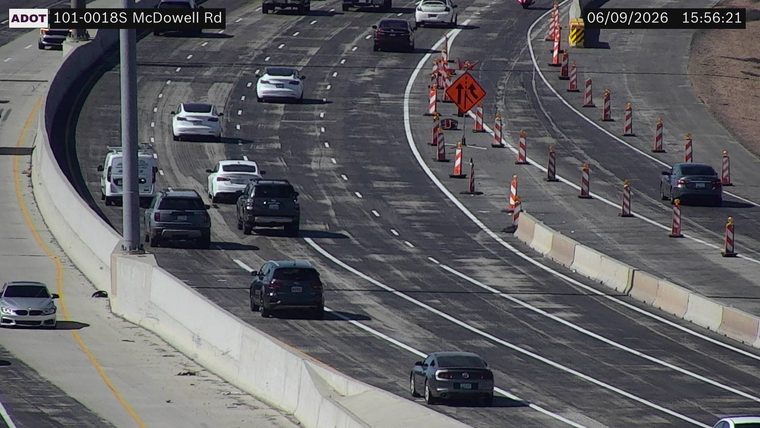 Construction cones and orange construction sign in the right lane