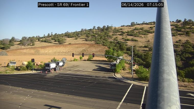 Construction equipment and cones in the roadway
