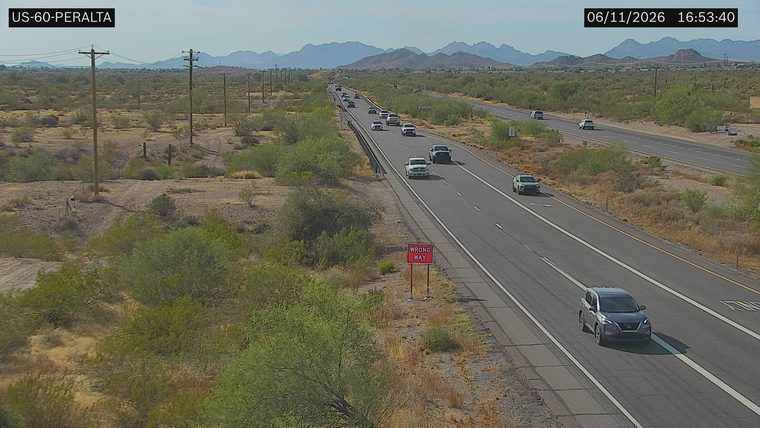 Wrong Way sign visible on the right side of the roadway