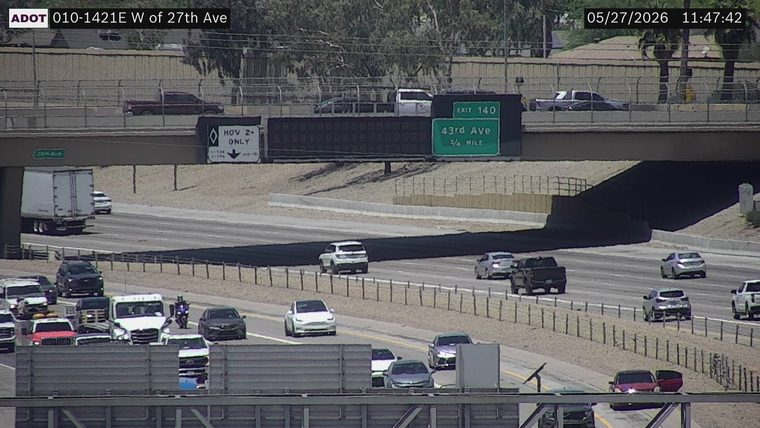 Red vehicle on the right shoulder with its driver-side door open