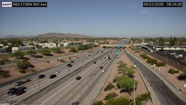Tow truck and a red SUV on the left shoulder