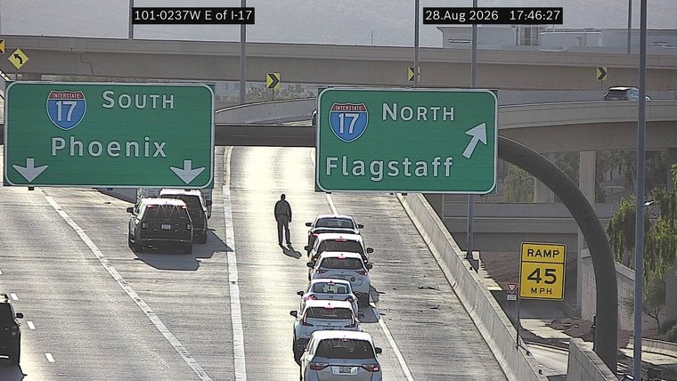 Person walking in the middle of the northbound lanes
