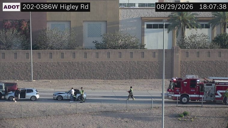 Two vehicles collided in the left lane, with a fire truck present