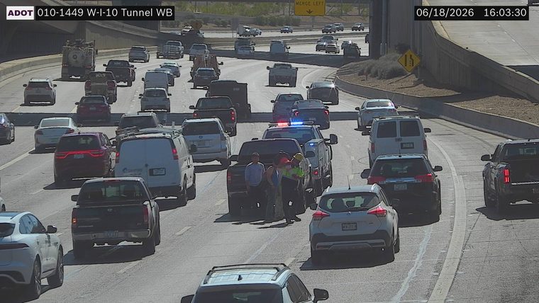 Police car with blue and red lights on the roadway