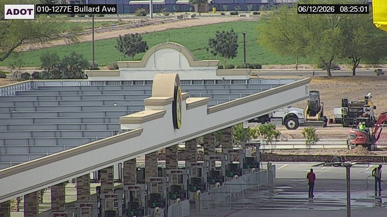 Construction equipment and workers on the roadway