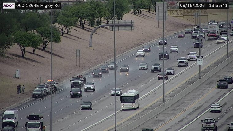 Tow truck with hazard lights on the right shoulder