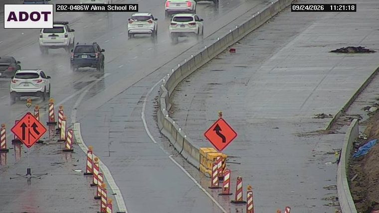 Construction cones and lane closure signs in the right lanes