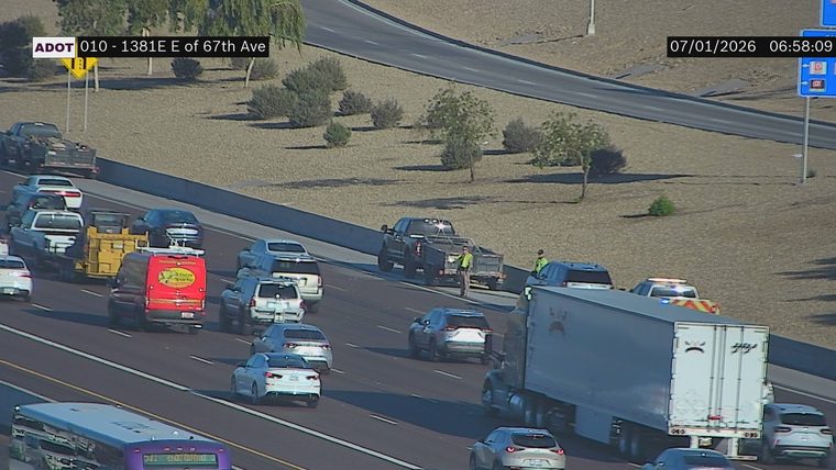 Police car with lights on the right shoulder