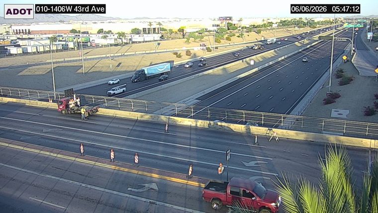 Construction cones and workers on the roadway