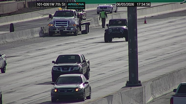 Tow truck with flashing lights on the roadway