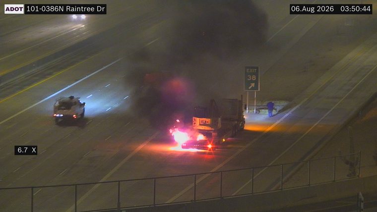 Truck on fire in the right lane