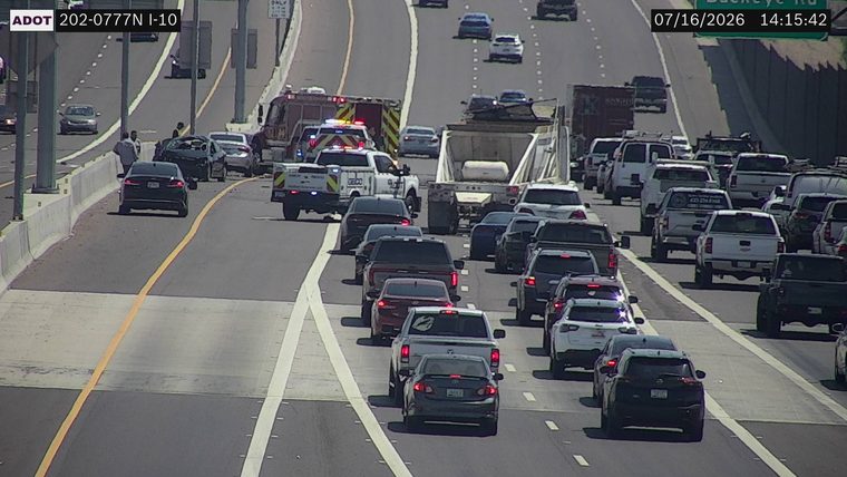 Two vehicles collided in the left lanes, with a fire truck and a pickup truck with emergency lights present