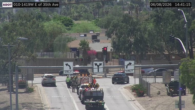 Construction cones and workers in the roadway