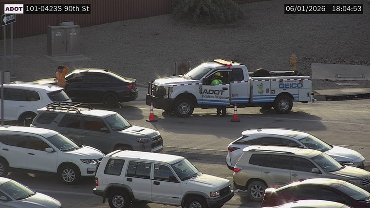 ADOT incident response truck with lights on and cones in the roadway