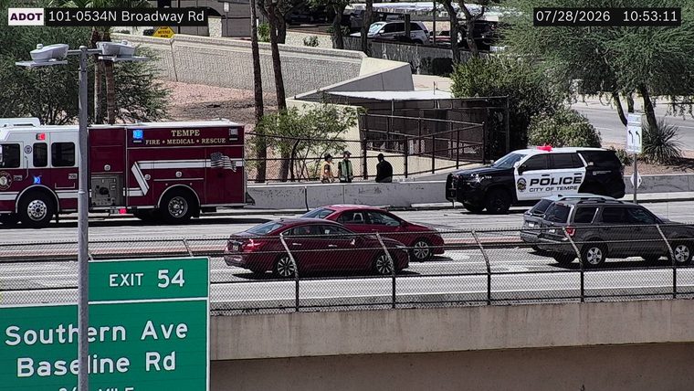 Tempe Police SUV and Tempe Fire truck with red and blue lights active on the right shoulder