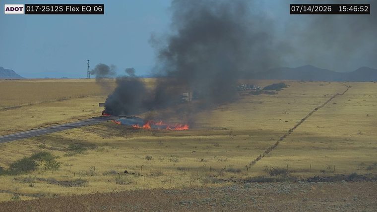 Fire and smoke on the right side of the roadway