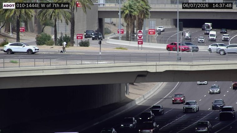 Person standing on the roadway