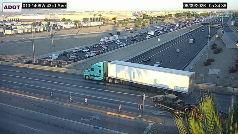 Tow truck on the right shoulder