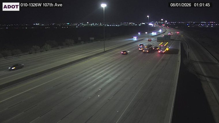 Fire truck with red and blue lights on the right shoulder