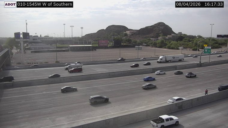 Person standing on the median barrier