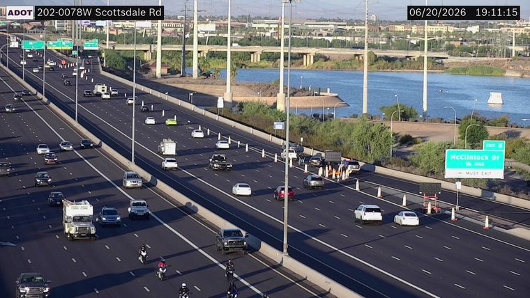 Construction cones and workers in the right lane