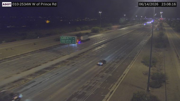 Truck with visible flames under the trailer in the right lane