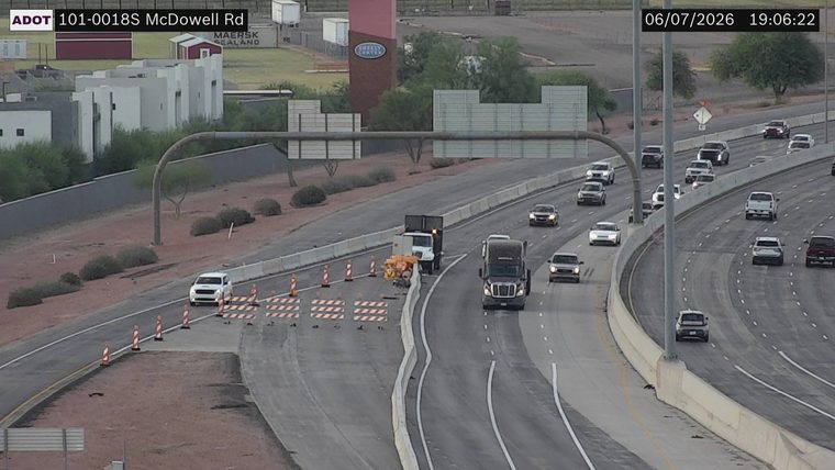 Construction cones and barriers in the left lane