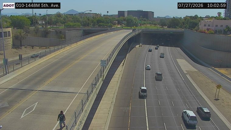 Person walking on the left shoulder