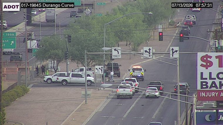 Police car with lights on in the intersection