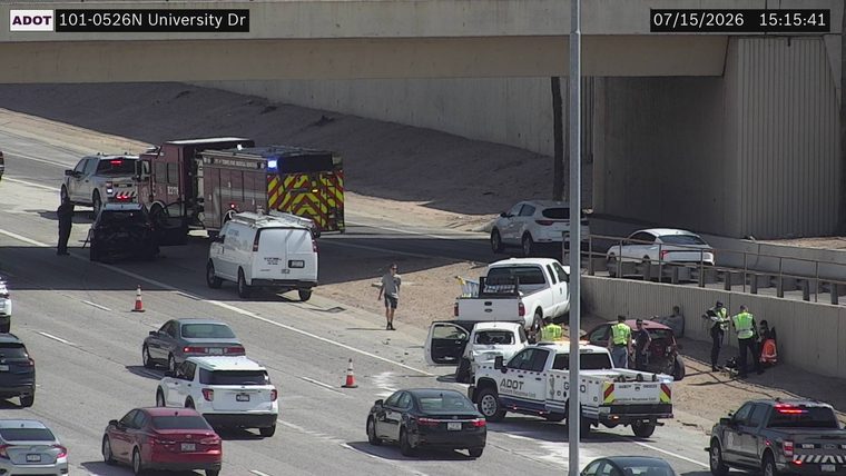 Multiple vehicles collided in the right lanes, with emergency responders present