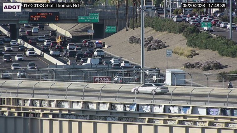 Police vehicle with flashing emergency lights on the highway in the background