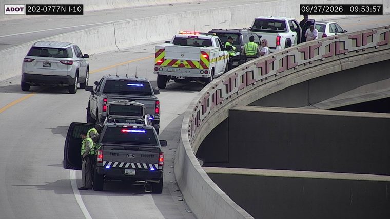 State trooper vehicle with lights on the shoulder