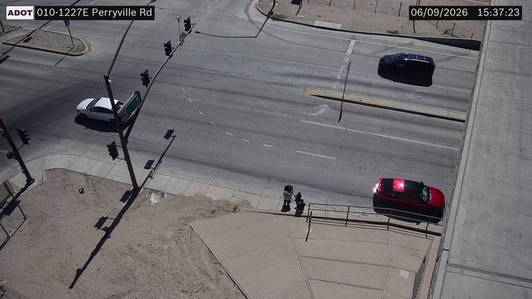 Red SUV with emergency lights on the right shoulder