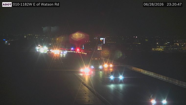Police car with red and blue lights on the roadway