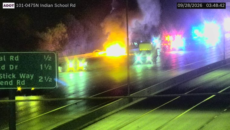 Vehicle fire with multiple emergency vehicles present in the left lanes